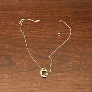 I’m selling a Tiffany rose gold and silver interlocking necklace.